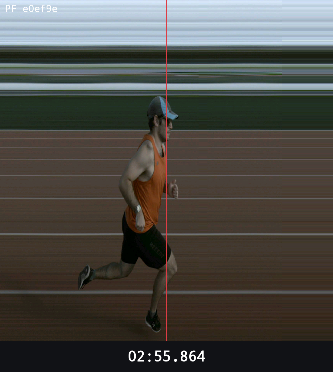 PF2500 line-scan photo-finish image of a runner crossing the line with a red timing cursor